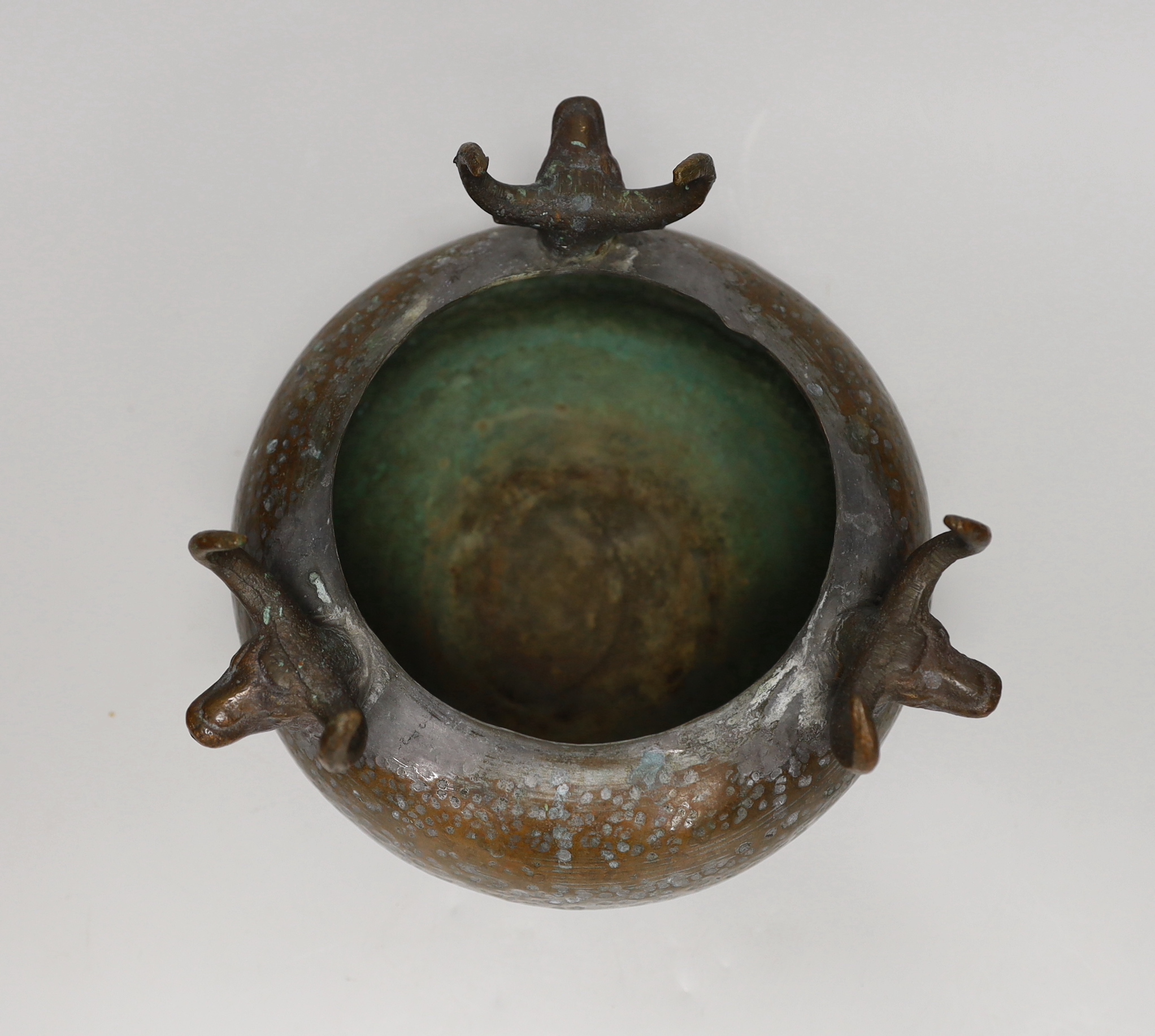 An Indian planished copper jardiniere, 15cm tall